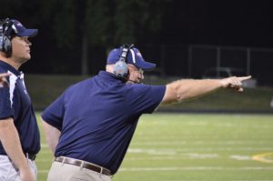 Photo/ Katie Berrell  Orono football head coach, Jeff Weiland, instructs his players during the fourth quarter of the Homecoming game against the Delano Tigers.