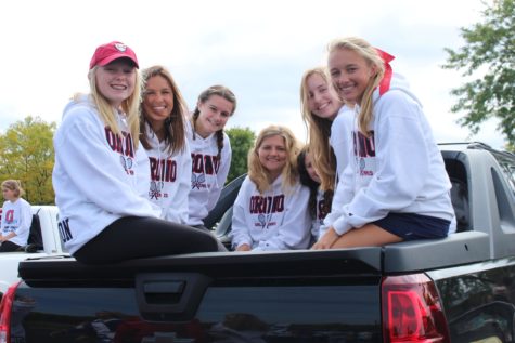 Orono Tennis girls show off their matching white sweatshirts