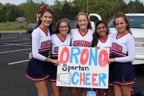 The Orono cheer squad show off their spartan spirit with their bows and sign