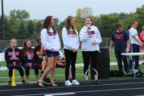 Senior tennis captains Sophie Peterson, Molly Swenson, and Caroline Martin are all smiles during their speech 