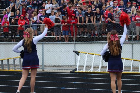 Senior captain Kate Edwards and junior captain Paige Krasnoff lead the Spartans in a cheer