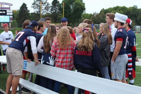 A pep talk before the homecoming court performs for the school