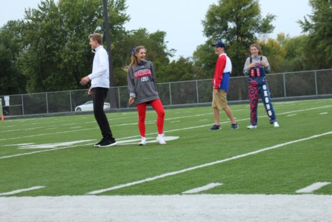 Seniors Jack Anderson, Grace Reiners, Aaron Patterson, and Maddie Fischer laugh during the court dance