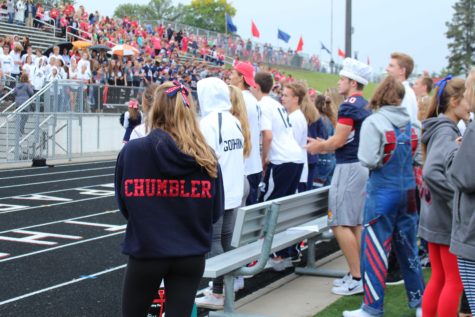 The homecoming court looks into the large crowd during Pep Fest