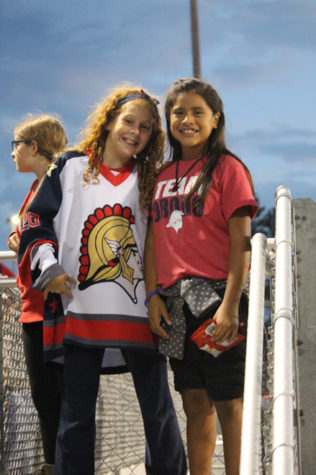 Two youngster spartan fans cheering on the home team.