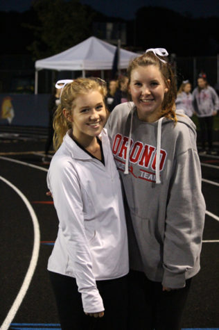 Dance team members Quinn Crandall (left) and Alexa Eichstadt (right) before their half time dance.