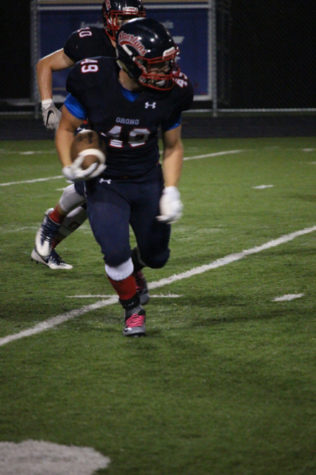 #49 Max Kahn with the ball for the spartans.