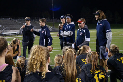 Senior Coach Drew Eiss gives his team a pregame pep talk. 