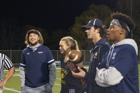 Senior Captain Tori Andrew stands among her experienced coaches.