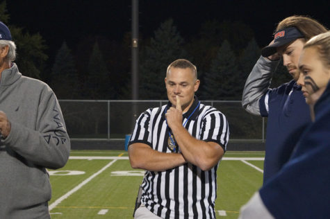 Officer White stands pensive before the game. 