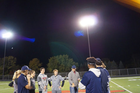 The coin is flipped at center field. 