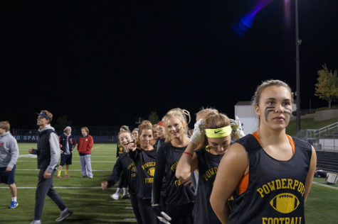 Senior ladies line up behind their captain for the national anthem. 