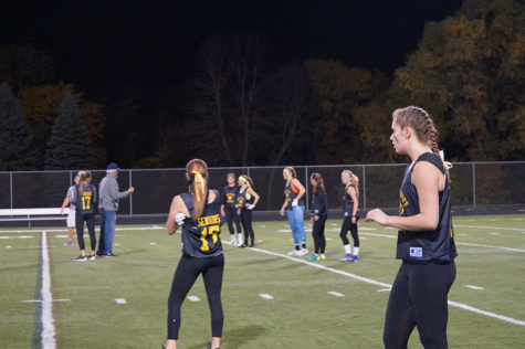 Girls take their time getting in position before the whistle. 