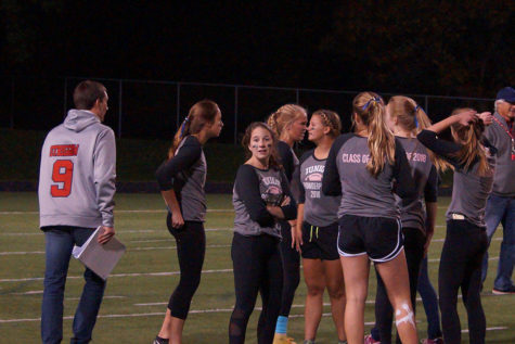 Junior girls huddle up to talk strategy. 