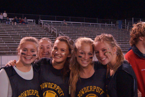 Seniors Sami Maddock, Megan Albers, Emma Stevenson, Jenna Rakos and Alexa Heller smile big after the team’s third touchdown. 