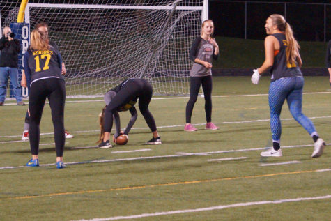 Senior Jackie Mitchell gets ready to snap the ball to Andrew. 