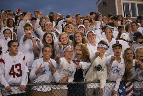 The seniors cheering for their boys of fall.