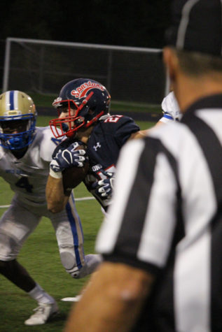 Senior receiver Luke Greenagel has the end zone in sight as he runs the ball down the field. 