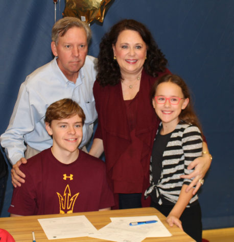 Senior Will Brenton takes a photo with his family