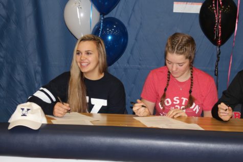 Seniors Tori Andrew and Sam Fischer sign their letters of intent